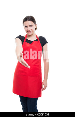 Friendly girl employee doing handshake or welcoming gesture isolated on white background Stock Photo