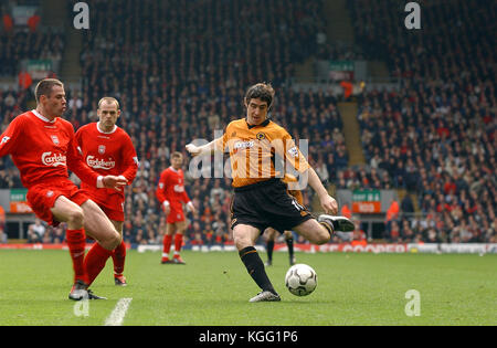 Footballer Jamie Carragher tackles Mark Kennedy Liverpool v Wolverhampton Wanderers 20 March 2004 Stock Photo