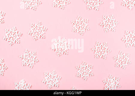 White toy snow flakes on blue background. Stock Photo