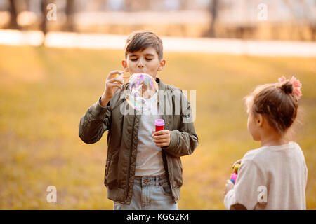 boy blowing soap bubbles Stock Photo