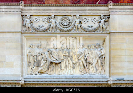 Paris, France. Arc de Triomphe du Carrousel (1808 - Place du Carrousel) Bas relief in rose marble: Napoleon entering Vienna (by Louis-Pierre Deseine) Stock Photo
