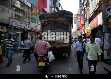 The Pettah Colombo Sri Lanka First Cross Street Overloaded Lorry on shopping street Stock Photo