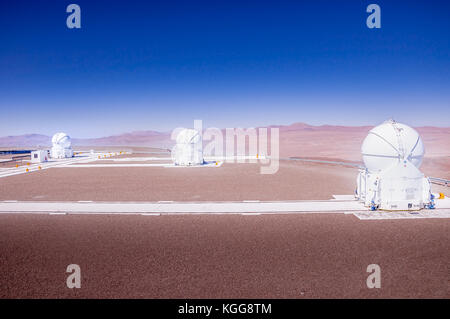 CERRO PARANAL, ATACAMA DESERT, CHILE - JAN. 15, 2010: The VLT, Very Large Telescope complex at the European Southern Observatory located on Cerro Paranal in the middle of the Atacama desert. Stock Photo