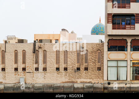 Detail of architecture in Bur Dubai with roof of Al Juma Mosque at the background Stock Photo