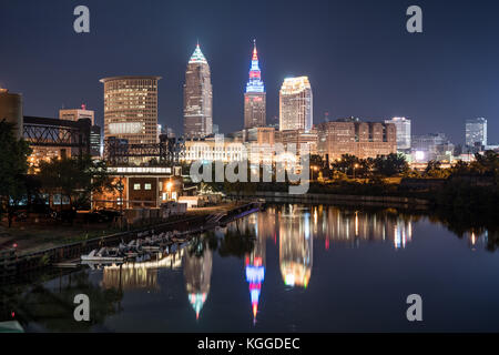 Cleveland city skyline and Detriot-Superior Bridge at night across the Cuyahoga river