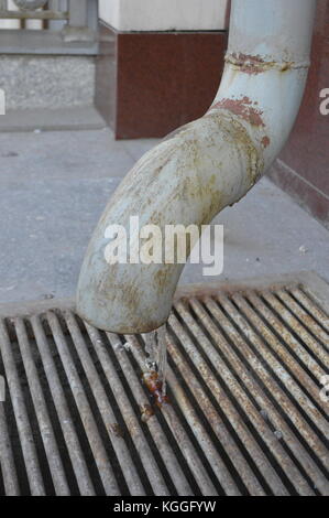 Frozen water coming out of pipe in cold Almaty, Kazakhstan. Stock Photo