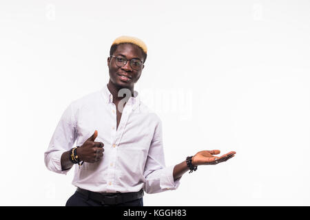 Close-up of happy young afro american man with open palm while showing thumb up gesture, looking at camera, isolated over white background Stock Photo