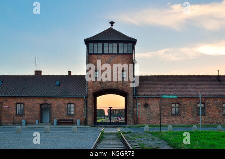 OSWIECIM, POLAND - JULY 29, 2017: The main gate to the concentration camp Auschwitz Birkenau in Oswiecim, Poland. Stock Photo
