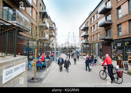 Shoppers on Gaol Ferry Steps at Wapping Wharf in Bristol Harbour UK Stock Photo