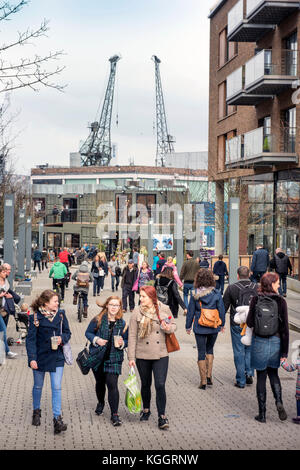 Shoppers on Gaol Ferry Steps at Wapping Wharf in Bristol Harbour UK Stock Photo