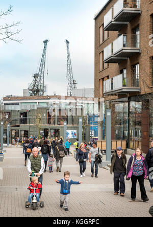 Shoppers on Gaol Ferry Steps at Wapping Wharf in Bristol Harbour UK Stock Photo