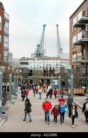 Shoppers on Gaol Ferry Steps at Wapping Wharf in Bristol Harbour UK Stock Photo