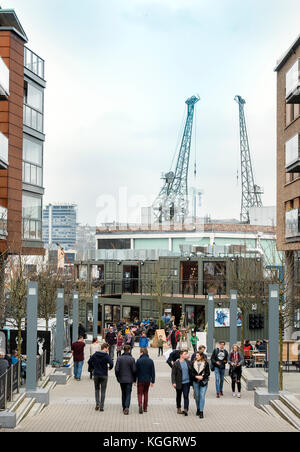 Shoppers on Gaol Ferry Steps at Wapping Wharf in Bristol Harbour UK Stock Photo