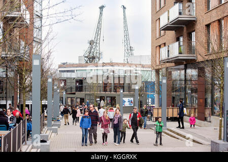 Shoppers on Gaol Ferry Steps at Wapping Wharf in Bristol Harbour UK Stock Photo