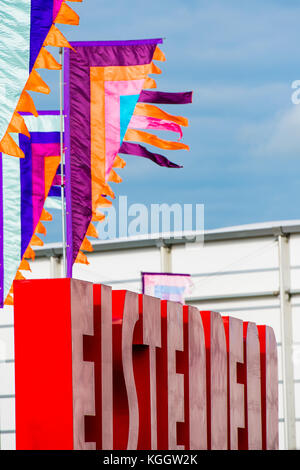 Signs and banners at The National Eisteddfod of Wales, 2017. The eisteddfod is a peripatetic annual festival of music, poetry, theatre dance and literature, visiting sites in north and south Wales on alternate years. Always held on the first whole week of August, the Eisteddfod  is the highlight of the welsh language social and cultural calendar Stock Photo