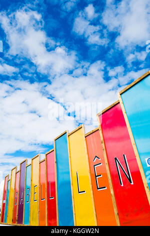 Signs and banners at The National Eisteddfod of Wales, 2017. The eisteddfod is a peripatetic annual festival of music, poetry, theatre dance and literature, visiting sites in north and south Wales on alternate years. Always held on the first whole week of August, the Eisteddfod  is the highlight of the welsh language social and cultural calendar Stock Photo