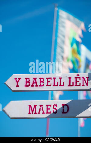 Signs and banners at The National Eisteddfod of Wales, 2017. The eisteddfod is a peripatetic annual festival of music, poetry, theatre dance and literature, visiting sites in north and south Wales on alternate years. Always held on the first whole week of August, the Eisteddfod  is the highlight of the welsh language social and cultural calendar Stock Photo