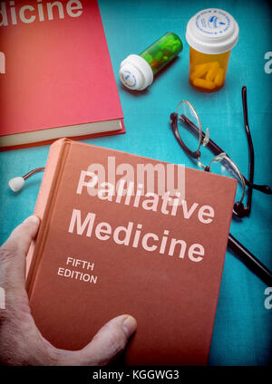 Doctor supports a book of palliative medicine in a medical laboratory Stock Photo