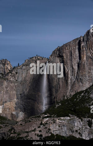 The night sky rises over Yosemite Falls in Yosemite National Park. Stock Photo