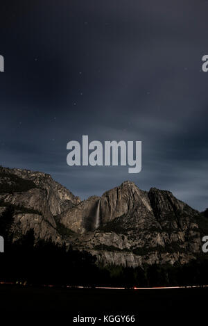 The night sky rises over Yosemite Falls in Yosemite National Park. Stock Photo