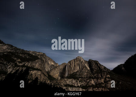 The night sky rises over Yosemite Falls in Yosemite National Park. Stock Photo