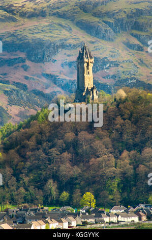 National Wallace Monument standing on a hill overlooking a village near Stirling Castle in Scotland, UK Stock Photo