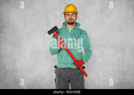 worker with a big hammer, portrait Stock Photo