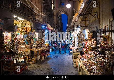 NAPLES, ITALY - OCTOBER 16, 2017: Night time view of the famous 'Christmas Alley' (Via San Gregorio Armeno) home to the Neapolitan Presepi (Nativity s Stock Photo