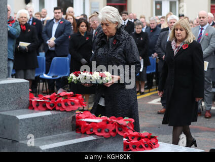 Margaret Veitch (left) and her sister Joan Anderson, whose parents William and Agnes Mullan were killed in the Enniskillen bombing, lay a wreath during the unveiling of a new memorial to the 12 victims of the IRA's 1987 Remembrance Sunday bomb attack in Enniskillen, Co Fermanagh. Stock Photo