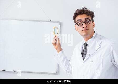 Funny doctor scientist making presentation in hospital Stock Photo