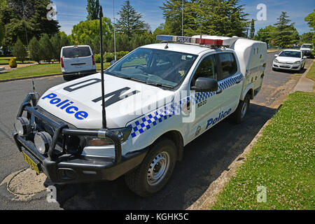 A New South Wales Police wagon parked outside the local police station ...