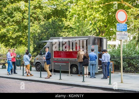 Brussels, Belgium - August 28, 2017: Street with bars and restaurants and people walking located in the center of Brussels, Belgium Stock Photo
