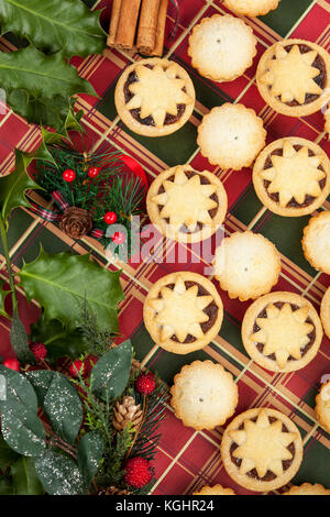 Mince Pies decorated with holly leaf shapes on gold dish Stock Photo ...