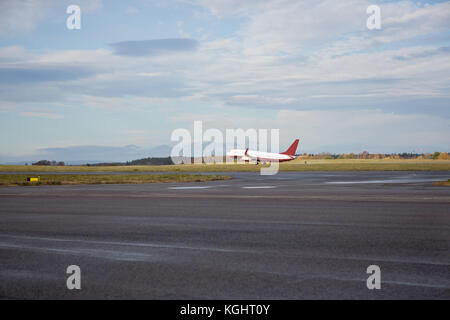 Airplane Taking Off From Wet Runway Stock Photo