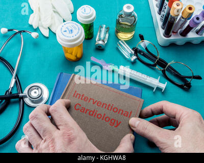 Doctor holds surgical intervention book, conceptual image Stock Photo