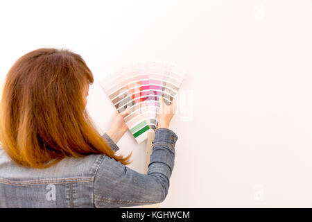 Interior design, renovation and decoration concept - woman working with color samples for selection Stock Photo