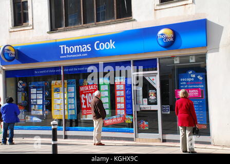 People outside a branch of Thomas Cook travel agents at Hastings in East Sussex, England on March 9, 2009. Stock Photo