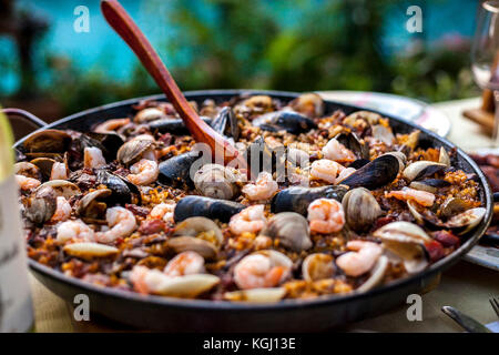 Traditional paella with seafood ready to be served. South Florida. Stock Photo