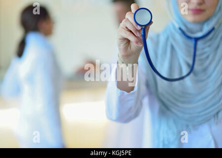 Confident Muslim doctor with hijab or medical student pose at hospital Stock Photo