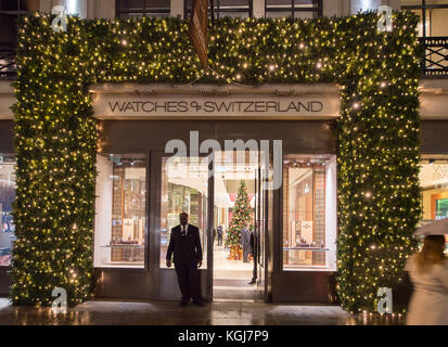 The West End, London, UK. 7th Nov, 2017. Shops in London's West End gear up for the Christmas season on the night Oxford Street lights are switched on. Festive Watches of Switzerland store entrance in Regent Street. Credit: Malcolm Park/Alamy Live News. Stock Photo
