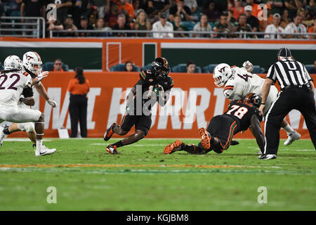 Miami Gardens, Florida, USA. 4th Nov, 2018. Miami Dolphins players storm  onto the field during the opening ceremony of an NFL football game between  the New York Jets and the Miami Dolphins