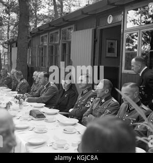 Lina Mathilde Heydrich (centre with black dress), the widow of  after  Deputy Protector of Bohemia and Moravia Reinhard Heydrich, killed by Czech paratroopers in 1942, Deputy Protector of Bohemia and Moravia Kurt DALUEGE, (sitting left next Lina Heydrich), and SS-Officer, (Gruppenfuhrer/Gestapo/SD) Karl Hermann Frank, (2nd right) attended  the ceremony  where The Reich Labour Service RLA (Reichsarbeitsdienst, RAD) camp  I-385 was named after Reinhard Heydrich (1904-1942) near Brno, The Protectorate of Bohemia and Moravia, September 21, 1942. Heydrich  was attacked in Prague on 27 May 1942 by S Stock Photo