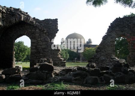 View of Gol Gumbaz behind ruins in Bijapur, Karnataka, India, Asia Stock Photo