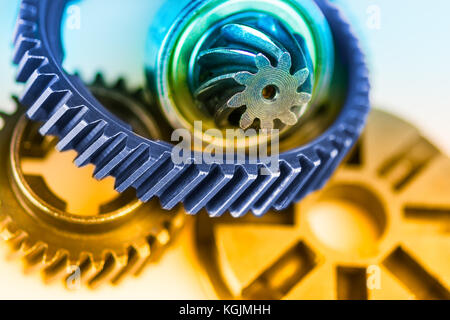 Color detail of various gearwheels. Abstract industrial background with engineering theme from cogwheels. Stock Photo