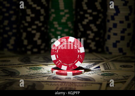 Red poker Chip at dollar background; Stock Photo