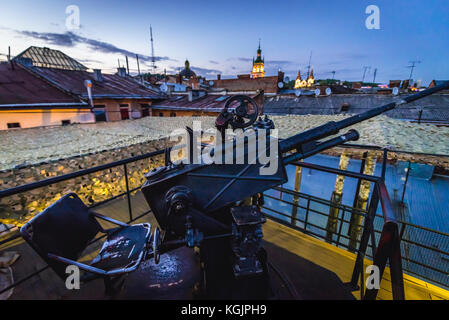 Artillery gun on the roof of Kryyivka (Hiding place - in English known as Underground Bunker) Restaurant and Bar on the Old Town of Lviv city, largest Stock Photo