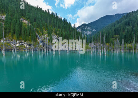 Kaindy Lake in Kazakhstan known also as Birch Tree Lake or Underwater forest. Stock Photo