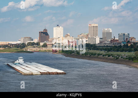 MEMPHIS, TN - OCT 10: Barge moves goods along the Mississippi river near downtown Memphis, Tennessee on October 10, 2017 Stock Photo