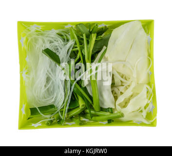 top view vegetables and vermicelli in basket isolated on white background Stock Photo