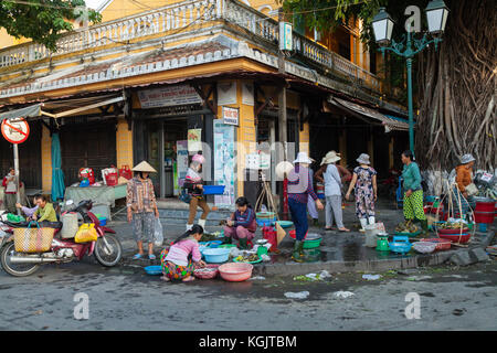 Early morning on a corner of Bach Dang street in Hoi An old town market. Vietnam. Stock Photo